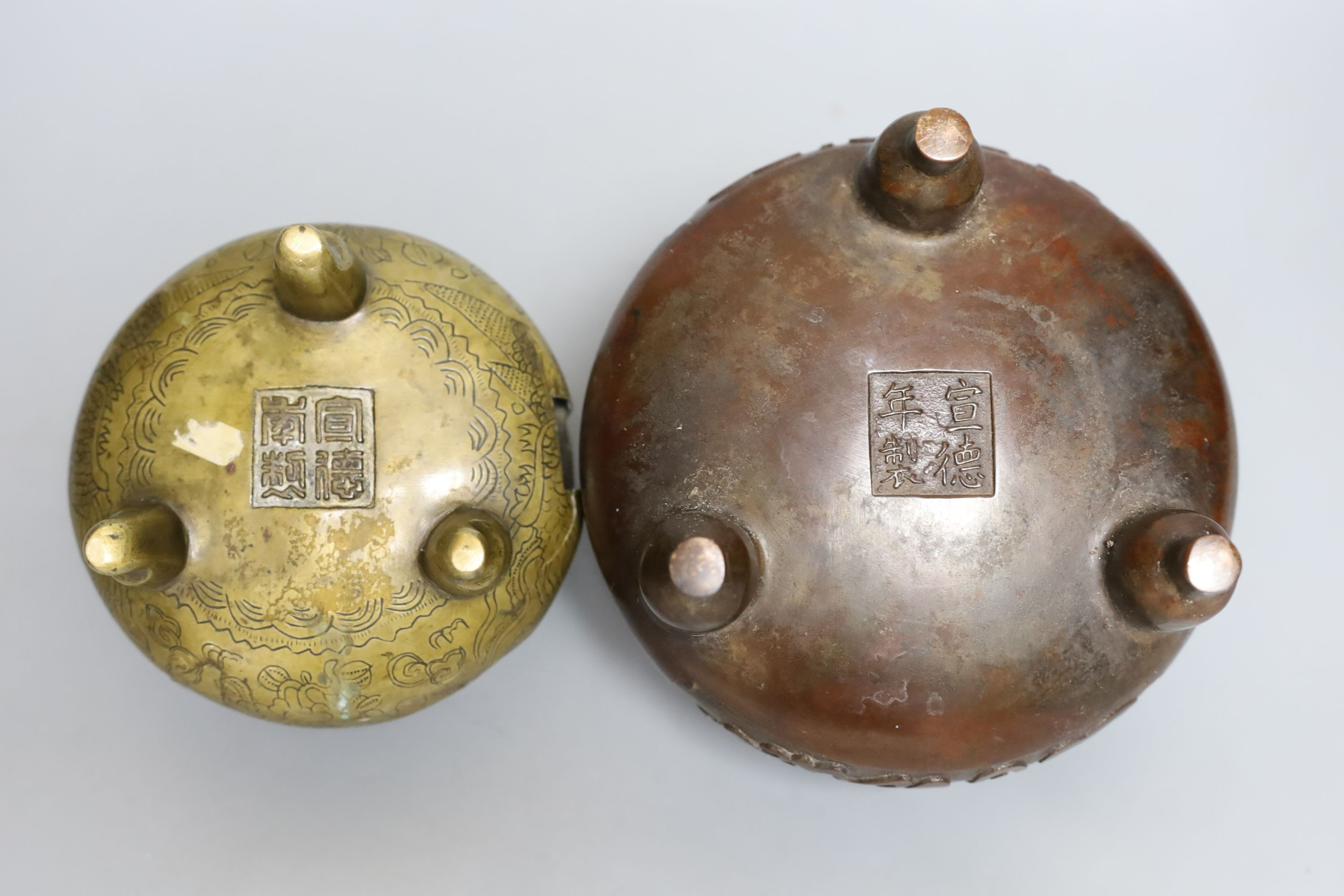 Two Chinese bronze tripod censers - tallest 13.5cm